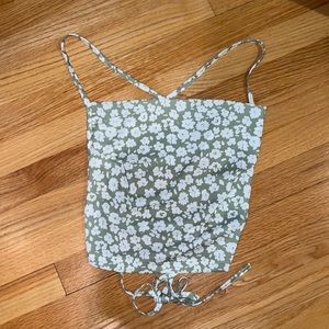 NEVER WORN green and white floral satin top. Crosses in the back!